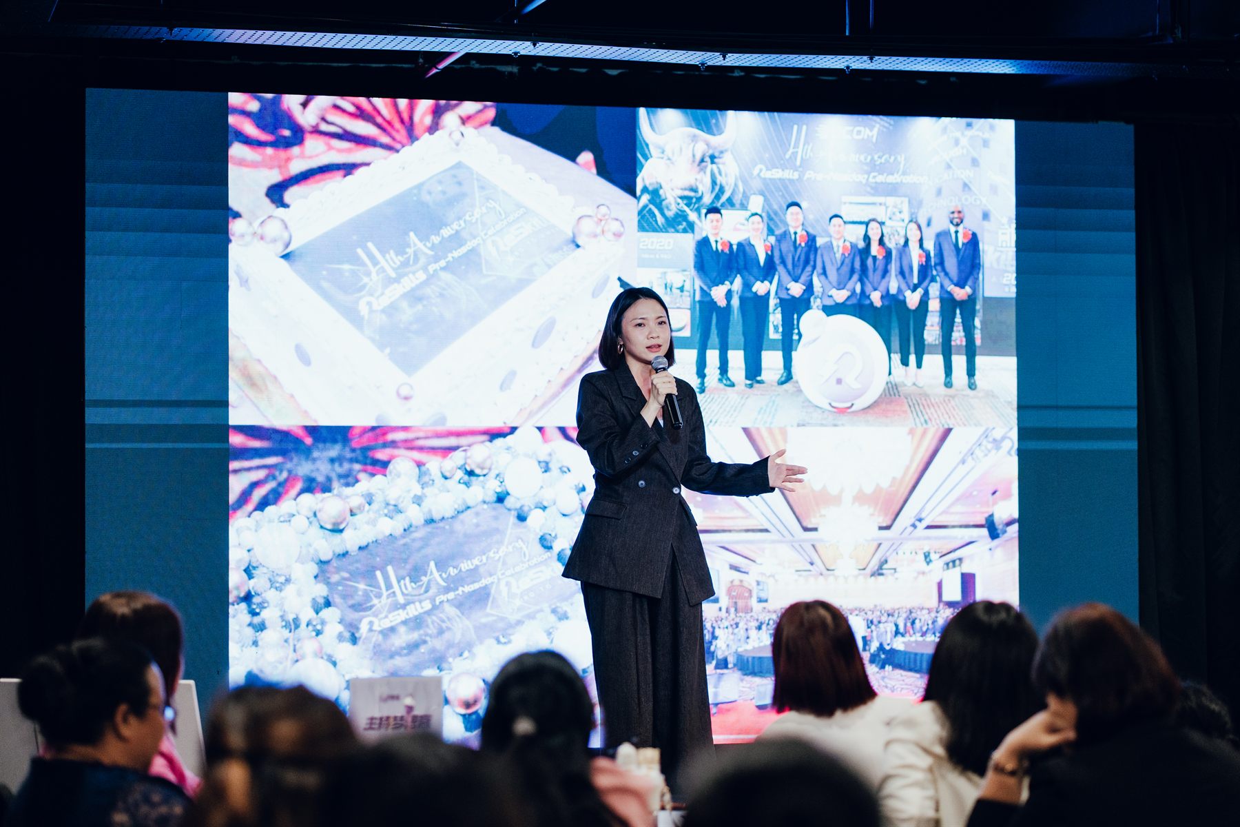 Yen hosting a corporate celebration on stage